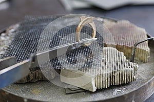 Jewellery making hand crafting a metal ring