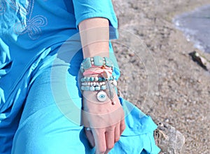 Jewelry advertisement on the beach - turquoise gemstone