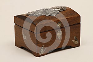 Jewelry box made of wood with additional workmanship and decorated. photo