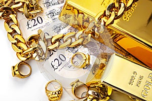 Jewelry buyer, pawn shop and buy and sell precious metals concept theme with pile of cash in british pounds, golden rings,