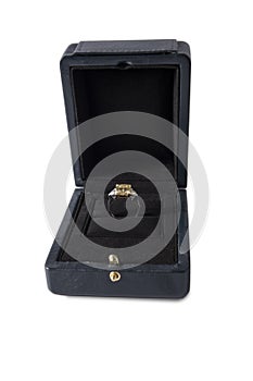 Jewelry, golden diamond ring in a box on a white background, isolated