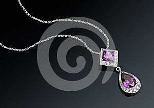 Jewelry pendant with chain and gems on darck background