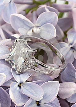 Jewelry Ring with big diamond on violet flower