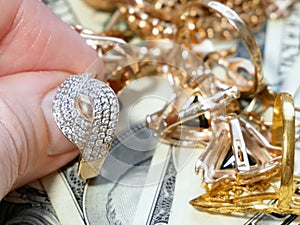 Jewelry scrap of gold and silver and money, pawnshop concept