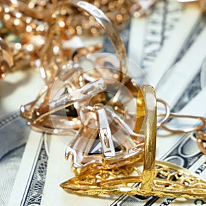 Jewelry scrap of gold and silver and money, pawnshop concept