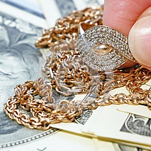 Jewelry scrap of gold and silver and money, pawnshop concept