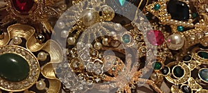 Jewelry vintage at the flea market. Rare things, brooches with stones