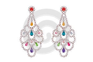 Jewelry on a white background. Women`s earrings premium with precious stones. Isolate Jewelry. Briliant.