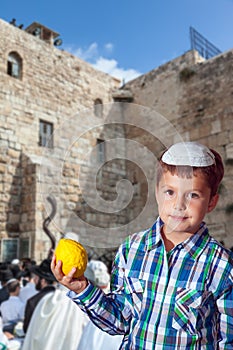 Jewish boy with etrog. The greatest shrine of Judaism