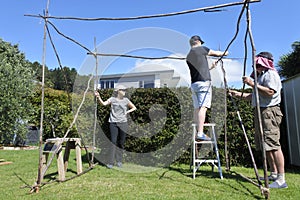 Jewish Family Building a Sukkah on Sukkoth Feast of Tabernacles Jewish Holiday photo