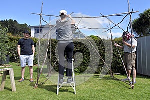 Jewish Family Building a Sukkah on Sukkoth Feast of Tabernacles Jewish Holiday photo