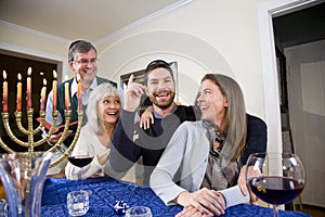 Jewish family celebrating Chanukah