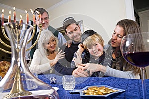 Jewish family celebrating Chanukah photo