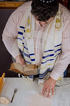 Jewish festival of Pesach with prayer of blessing during the preparation of kosher matzah
