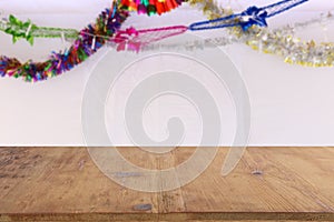 Jewish festival of Sukkot. Traditional succah (hut) with decorations. Empty wooden old table