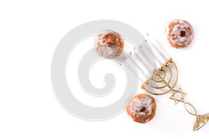 Jewish Hanukkah menorah and sufganiyot donuts isolated on white background