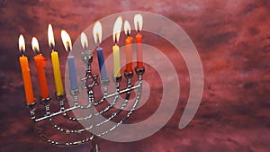 Jewish holiday hannukah symbols - menorah and wooden dreidels.