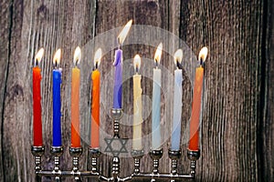 Jewish holiday Hanukkah background with menorah over chalkboard