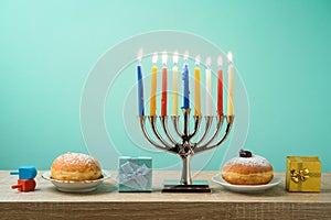 Jewish holiday Hanukkah background with menorah, sufganiyot, gif