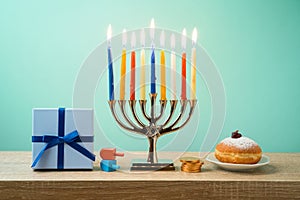 Jewish holiday Hanukkah background with menorah, sufganiyot, gif