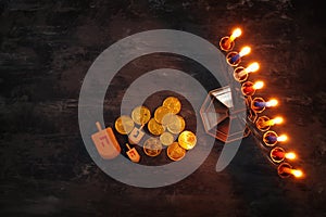 jewish holiday Hanukkah background with traditional spinnig top, menorah & x28;traditional candelabra& x29; and burning candles