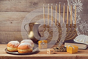 Jewish holiday Hanukkah celebration with vintage menorah