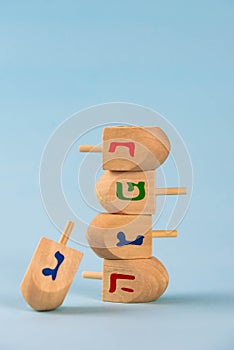 Jewish holiday Hanukkah concept. Wooden dreidel spinning top