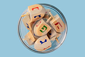 Jewish holiday Hanukkah concept. Wooden dreidel spinning top