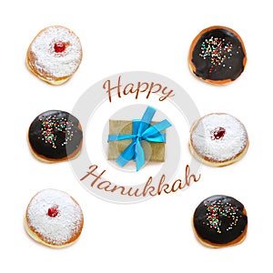 jewish holiday Hanukkah image with traditional doughnuts isolated on white.