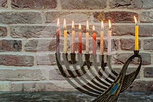 Jewish holiday Hanukkah with menorah traditional candelabra and Burning candles