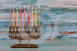 Jewish holiday Hanukkah with menorah traditional candelabra and Burning candles