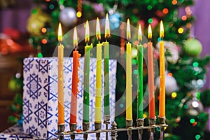 Jewish holiday Hanukkah with menorah traditional candelabra burning candles