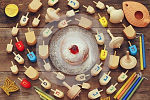 jewish holiday Hanukkah with wooden dreidel (spinning top)