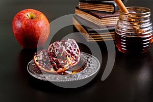 Jewish holiday honey and apples with pomegranate