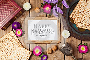 Jewish holiday Passover background with photo frame, matza and seder plate.