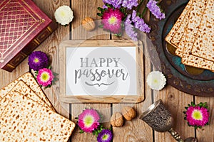 Jewish holiday Passover background with photo frame, matza and seder plate. photo