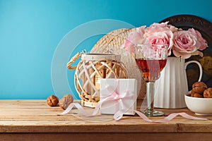 Jewish holiday Passover concept with wine glass, matzah and gift box on wooden table