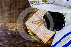 Jewish holiday passover matzot with seder on plate on table close up