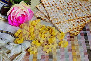 Jewish holiday passover matzot with seder on plate on table close up