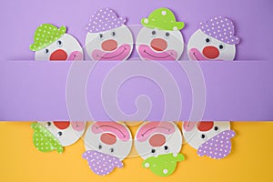 Jewish holiday Purim background with childish paper clowns