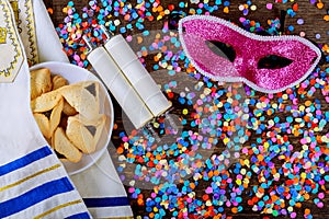 Jewish holiday Purim with carnival mask and hamantaschen cookies. Flat lay