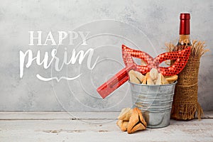 Jewish holiday Purim greeting card with hamantaschen cookies or hamans ears, carnival mask and wine