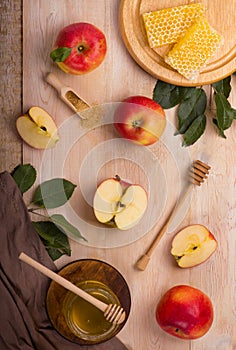 Jewish holiday Rosh Hashana background with apples and honey on blackboard. View from above. Flat lay