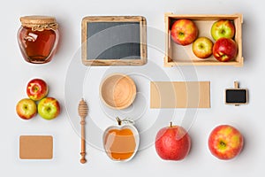 Jewish holiday Rosh Hashana mock up template with honey jar,apples and chalkboard. View from above. Flat lay