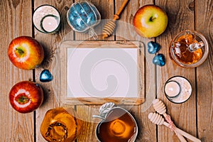 Jewish holiday Rosh Hashana poster mock up template with honey and apples on wooden table. View from above.