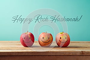 Jewish holiday Rosh Hashanah background with smiling apples