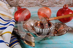 Jewish Holiday Rosh hashanah honey and apples with pomegranate