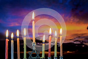 Jewish holiday symbol Hanukkah menorah sunset sky clouds