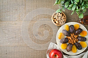 Jewish holiday Tu Bishvat background with dried dates, fruits and nuts. Top view with copy space