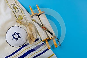 Jewish holidays, during prayer items kippa with prayer shawl tallit on shofar, torah scroll